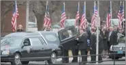  ??  ?? Mourners gather as the hearse arrives.