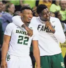  ??  ?? Baylor’s King McClure (22) and Mario Kegler smile during the Bears’ victory against Kansas.
RAYMOND CARLIN III/USA TODAY SPORTS