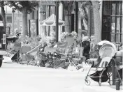  ?? BRIAN CASSELLA Chicago Tribune/TNS ?? People’s belongings sit along the parade route after people fled in Highland Park, Illinois, on Monday.