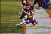  ?? JEFF ROBERSON — THE ASSOCIATED PRESS ?? Kansas City Chiefs tight end Travis Kelce (87) dives toward the goal line over Buffalo Bills cornerback Josh Norman (29) during the first half of the AFC championsh­ip game Sunday in Kansas City, Mo. Kelce was ruled out of bounds on the play.