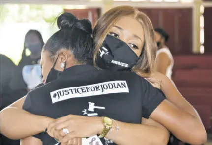  ??  ?? In this Jamaica Observer file photo, Portia Haughton hugs her daughter Shanice Lloyd during the funeral to mark the life of her beloved sister, Jodian Fearon earlier this year.