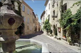  ??  ?? SLEEPY BEAUTY: The pretty village of Venasque. Below: Max on his bike