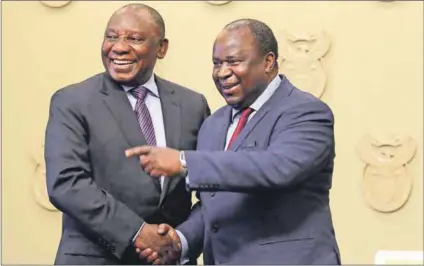  ??  ?? SHA SHA: President Cyril Ramaphosa congratula­tes newly appointed Finance Minister Tito Mboweni, who is expected to make his presence felt regarding economic strategy. Photo: Reuters/Sumaya Hisham