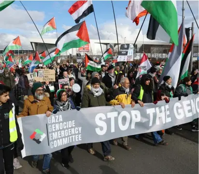  ?? Image: Colin Mearns ?? Pro-Palestine activists demonstrat­e near Glasgow’s Emirates Arena