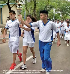  ??  ?? Olympians Heshan Unamboowe, Reshika Udugampola and Anuradha Indrajith Cooray leading the Olympic Day Run in Colombo.