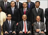  ?? EUGENE HOSHIKO / AP ?? Treasury Secretary Steven Mnuchin (left bottom) and China’s Finance Minister Liu Kun (right top) pose with other G-20 finance ministers and central bank governors meeting in Fukuoka, Japan, on Sunday.