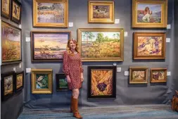 ??  ?? Past SEWE Featured Artist Peggy Watkins by her collection in the 2018 Fine Art Gallery.