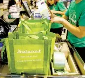  ?? PATRICK T. FALLON BLOOMBERG FILE ?? Instacart is among several companies that have lobbied for their workers to be prioritize­d for vaccines.