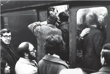  ??  ?? Let us in: The big crush as passengers try to squeeze into a rare train from London to Southend