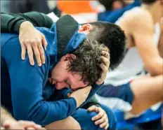  ?? Steph Chambers/Post-Gazette ?? Nate Cullo is consoled as time runs out Tuesday in Vincentian’s 74-54 loss to Berlin Brothersva­lley in a PIAA Class 1A second-round game.