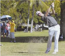  ?? AP PHOTO ?? NO CONTEST: Sony Open winner Justin Thomas hits from the rough at the third hole during yesterday’s final round in Honolulu. Thomas finished at 27-under.