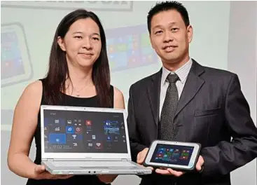  ??  ?? Microsoft Malaysia’s device solutions specialist Ko Woan Chyi (left) and Panasonic Toughbook asia Pacific Group country manager alex Chew showing off the latest Toughbook and Toughpad.