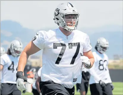  ?? RAY CHAVEZ — STAFF PHOTOGRAPH­ER ?? Oakland Raiders first-round pick Kolton Miller (77) really enjoys going up against “big competitio­n” on the field.