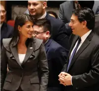  ?? (Shannon Stapleton/Reuters) ?? US AMBASSADOR to the UN Nikki Haley speaks with Israeli Ambassador Danny Danon before a Security Council vote on an Arab-backed resolution for protection of Palestinia­n civilians, at the UN headquarte­rs on Friday.