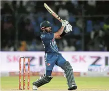  ?? GETTY IMAGES/ ALEX DAVIDSON ?? POWER MOVES: Pakistan's Babar Azam hits runs during the 2nd T20I match against England on Thursday in Karachi, Pakistan. Picture:
