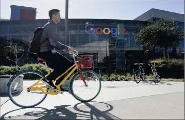  ?? PHOTO: BLOOMBERG ?? A cyclist rides past Google offices inside the Googleplex headquarte­rs in Mountain View, California. Yesterday’s EU record fine caps a seven-year probe into the company.