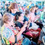  ?? PHOTOGRAPH COURTESY OF GLOBE ?? GLOBE volunteer Janette Patricia Guillen (standing) assists senior participan­ts at Globe’s ‘Teach Me How to Digi’ Learning Session.