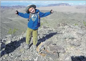  ?? COURTESY OF CHRIS MEYER ?? Kenny Meyer, then 5, stands atop a mountain near Hoover Dam he calls Peanut Peak in 2012. Lake Mead, Boulder City and the Hoover Dam bypass bridge can be seen from the 2,500-foot summit.