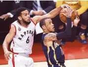  ?? Nathan Denette / Associated Press ?? The Raptors’ Cory Joseph swoops in from behind to stop a drive by the Pacers’ Monta Ellis.