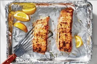  ?? FOOD STYLIST: MONICA PIERINI. JULIA GARTLAND/THE NEW YORK TIMES ?? A broiled salmon with mustard and lemon. This recipe is only six ingredient­s, including salt and pepper.