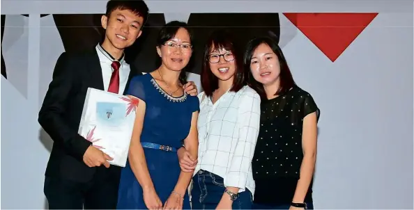  ??  ?? Top student Chang (left) with his mother and sisters after the South Australian Matriculat­ion/SACE Internatio­nal Awards Ceremony.