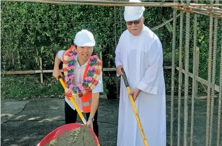  ?? Photo: Embassy of Japan ?? Embassy of Japan’s Second Secretary Mizutani Masataka and Father Cecil Williams during the groundbrea­king ceremony on December 29, 2020.