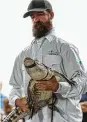  ?? Amr Alfiky / Associated Press ?? Florida trapper Frank Robb holds the alligator, dubbed Chance the Snapper.