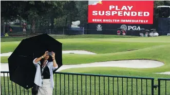  ?? CHARLIE RIEDEL/THE ASSOCIATED PRESS ?? Second-round play was suspended following thundersto­rms and rain Friday at the PGA Championsh­ip at Bellerive Country Club in St. Louis. The round is set to be completed Saturday.