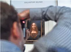  ?? JEWEL SAMAD, AFP/GETTY IMAGES ?? Leonardo da Vinci’s Salvator Mundi is unveiled at Christie’s in New York on Oct. 10. It’s the only one of 20 paintings by da Vinci in private hands.