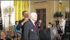  ?? LUKE SHARRETT / THE NEW YORK TIMES ?? President Barack Obama awards the Presidenti­al Medal of Freedom to John Glenn at the White House in Washington in 2012.