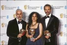  ?? PHOTO BY JOEL C RYAN/INVISION/AP ?? Ian Canning, from left, Tanya Seghatchia­n and Emile Sherman hold the Best Film award on behalf of Jane Campion for the film ‘Power of the Dog’ at the 75th British Academy Film Awards in London on Sunday.