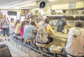  ?? Marc Stirdivant Marc Stirdivant ?? LOCALS PACK Dallas’ Record Grill, which serves simple, inexpensiv­e breakfasts and lunches. According to legend, this is where Bonnie and Clyde first met.