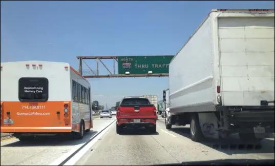  ?? ART MARROQUIN/LAS VEGAS REVIEW-JOURNAL ?? Big rigs and buses compete with vehicles for space on the northbound 605 freeway in Los Angeles County on May 27. Freeways were congested as travelers headed to Las Vegas and other destinatio­ns on the Friday leading into Memorial Day weekend.