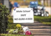  ?? LANNIS WATERS /T HE PALM BEACH POST ?? A gun control sign is posted down the street from Marjory Stoneman Douglas High School as students and their parents arrived on Feb. 28.