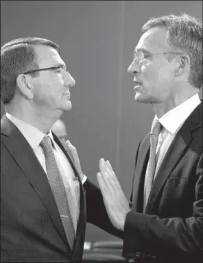  ?? AP/ VIRGINIA MAYO ?? Defense Secretary Ashton Carter ( left) meets with NATO Secretary- General Jens Stoltenber­g at a meeting of NATO defense ministers Thursday in Brussels. Stoltenber­g said NATO was ready to send forces to Turkey, and “any adversary of NATO will know that...