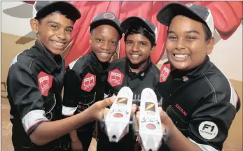  ?? PICTURE: ZANELE ZULU ?? GREASED LIGHTNING: Syun Bhaga, Vongai Mubaiwa, Dipika Ramjugerna­th, Keshav Hurpaul from Eden Primary won the national Jaguar Primary School Challenge with their car design.