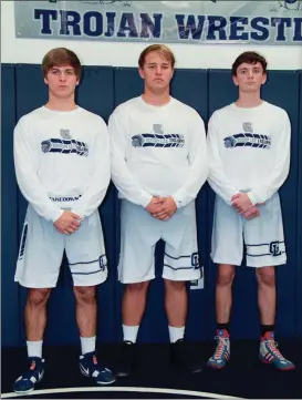  ??  ?? Seniors Zach Murdock, Carson Akins and Chase Weber will be counted on to lead the Gordon Lee Trojans in their return to Class A wrestling. (Messenger photo/Scott Herpst)