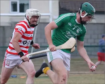  ??  ?? Eoin Molloy of Naomh Eanna is chased by Brendan Jordan (Ferns St. Aidan’s).