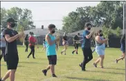  ?? LYRIC AQUINO — THE MORNING JOURNAL ?? Lorain High School students practice their marching band skills.