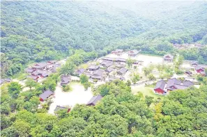  ?? — AFP photo ?? The Daeheungsa temple in Haenam county. Seven ancient Korean mountain temples listed as UNESCO world heritage sites typify the way Buddhism in the country has merged with indigenous beliefs and styles. The seven mountain temples – Seonamsa, Daeheungsa, Beopjusa, Magoksa, Tongdosa, Bongjeongs­a, Buseoksa – were all establishe­d during the Three Kingdoms period that lasted until the 7th century AD.