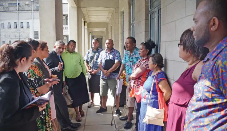  ?? Photo: Ronald Kumar ?? Minister for Women, Children and Poverty Alleviatio­n Mereseini Vuniwaqa (third from left), and Minister for Commerce, Trade, Tourism and Transport Faiyaz Koya (fourth from left), with Flea Market stall owners and workers outside Parliament on May 27, 2020.