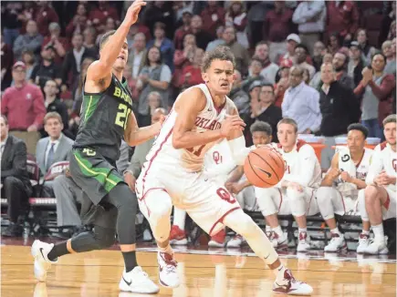  ??  ?? Oklahoma’s Trae Young leads the nation in scoring (30.3 average) and assists (9.5 per game). MARK D. SMITH/USA TODAY SPORTS