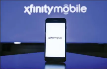  ?? JEFF FUSCO/AP IMAGES FOR COMCAST ?? Cable giant Comcast will start selling cellphone plans called Xfinity Mobile in the coming months, using a network it’s leasing from Verizon.