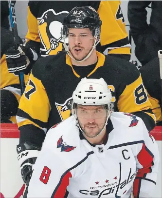  ?? ASSOCIATED PRESS FILE PHOTO ?? Penguins’ Sidney Crosby and Capitals’ Alex Ovechkin (8) skate during the first period of an NHL game earlier this month. The Penguins and Capitals are facing off in the second round for the third consecutiv­e year.