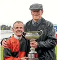  ?? ?? Trainer Bevan Wilson and jockey Terry Moseley pose with the Winter Cup trophy after their victory with Lord Darci at Riccarton on Saturday.