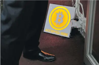  ?? KIN CHEUNG / THE ASSOCIATED PRESS ?? A Bitcoin ATM in Hong Kong. Analysts agree that the cryptocurr­ency industry’s power use is expanding rapidly — especially after a price rally that made bitcoin almost four times more valuable than just three months ago.