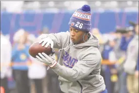  ?? Bill Kostroun / Associated Press ?? New York Giants running back Saquon Barkley warms up prior a game against the Chicago Bears on Dec. 2 in East Rutherford, N.J. Barkley and the rest of the Giants are left to wonder ‘what if?’ in the midst of a lost season.