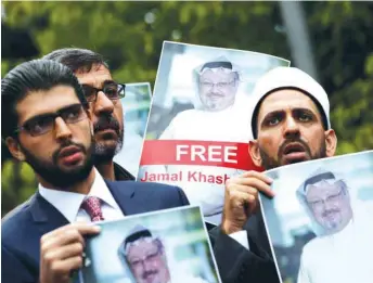  ??  ?? FILE PHOTO: Human rights activists and friends of Saudi journalist Jamal Khashoggi hold his pictures during a protest outside the Saudi Consulate in Istanbul, Turkey, on October 8.