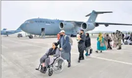  ?? ANI ?? People reach the Hindan Air Force Station after evacuation from Kabul, on Sunday.