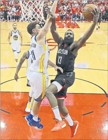  ?? JOSE CARLOS FAJARDO — STAFF PHOTOGRAPH­ER ?? The Warriors’ Klay Thompson, left, challenges Houston’s James Harden as he tries a layup during the conference finals.